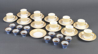 An Art Deco part Adderley ware yellow and white banded coffee set together with 12 blue and white Saki bowls 