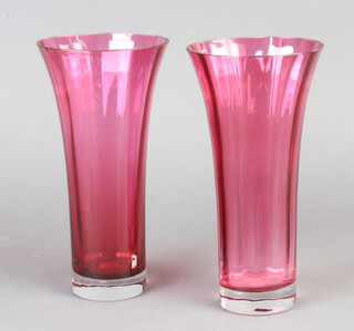A pair of cranberry glass trumpet shaped vases 24cm h x 7cm diam. 