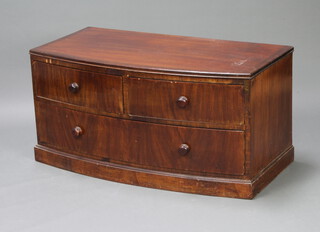 A Victorian mahogany bow front chest of 2 short and 1 long drawer, raised on a platform base 51cm x 105cm w x 53cm d (reduced in height, veneers missing to the front and crack to the top) 