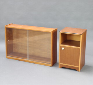 A mid Century teak rectangular bookcase, fitted a shelf enclosed by a glazed sliding panelled door 60cm h x 91cm w x 23cm d and 1 other teak bedside cabinet 62cm h x 37cm w x 33cm 