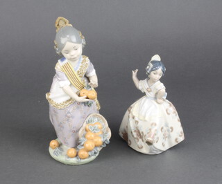 A Lladro figure of a Spanish lady with oranges 1422 20cm, ditto "Dancing" 5375 13cm  (The dancing figure is missing something from her hand)