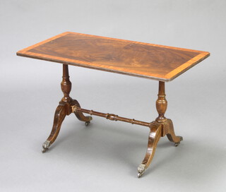 A Georgian style rectangular crossbanded mahogany coffee table raised on turned supports 49cm h x 81cm w x 43cm d 