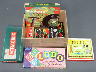 A collection of board games including Scrabble and roulette