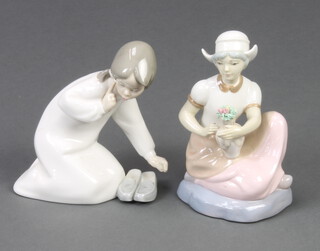 A Lladro figure of a kneeling girl with slippers 15cm, a Spanish figure of a girl with a vase of flowers 16cm (the 2nd figure has minor chips) 