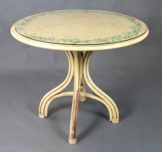 A circular painted oak occasional table with vinery decoration, raised on a bentwood base 76cm h x 89cm diam. (some paint loss to the base) 