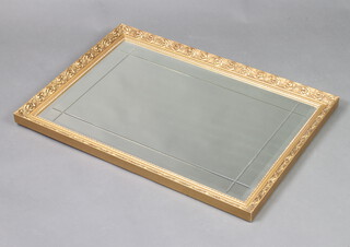 A rectangular bevelled plate and cut glass mirror contained in a gilt frame 60cm x 86cm 