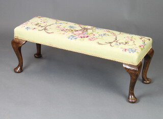 A rectangular Victorian style mahogany stool with Berlin woolwork seat raised on cabriole supports 23cm h x 86cm w x 30cm d 