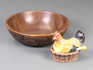 An African carved hardwood bowl 12cm x 42cm and a Casa Pupo pottery egg store in the form of a chicken 20cm x 20cm x 13cm 