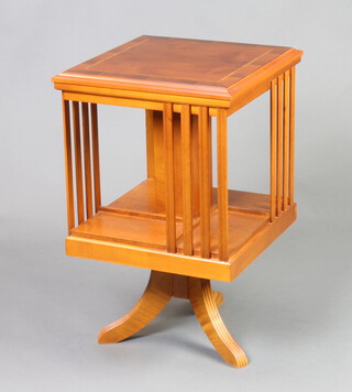 A Georgian style square inlaid mahogany revolving bookcase raised on a pillar and tripod base 67cm h x 42cm w x 42cm d 