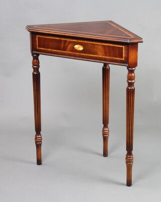 A Georgian style inlaid mahogany corner table raised on turned and fluted supports 76cm h x 64cm w x 46cm d (slight scratch to top)  
