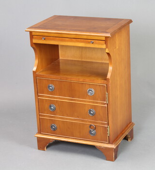 A Georgian style crossbanded mahogany bedside cabinet with brushing slide above recess, base enclosed by a panelled door with dummy drawer front, 66cm h x 45cm w x 30cm d 