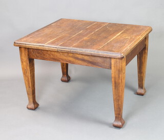 An Art Nouveau beech extending dining table raised on square tapered supports, 70cm h x 89cm w  x 103cm l 