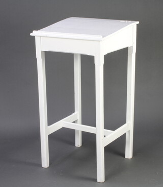 A 19th Century white painted clerk's slope, on square supports with H framed stretcher 112cm h x 61cm w x 85cm d (no inkwell)