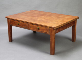 A rectangular pine coffee table fitted 2 drawers, raised on square tapered supports 54cm h x 121cm w x 87cm d 