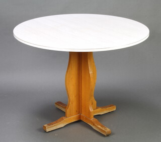 A beech framed and white formica circular pedestal table raised on a cruciform base 75cm h x  100cm diam. 