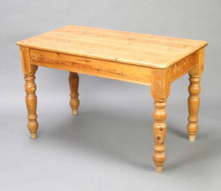 A Victorian style rectangular pine kitchen table raised on turned supports 76cm h x 124cm l x 70cm w (some pitting/scratch marks to the top, gnaw marks to 1 of the legs) 