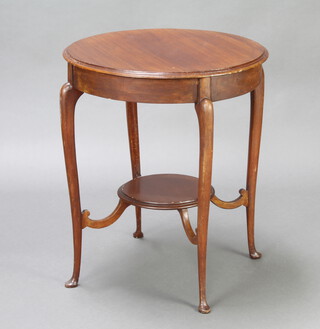 An Edwardian circular mahogany 2 tier occasional table raised on cabriole supports 69cm h x 58cm diam. 