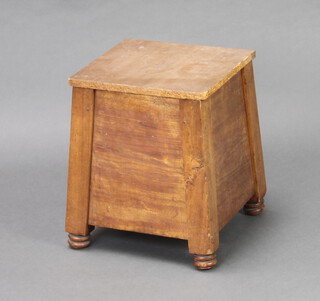 An Edwardian mahogany square waisted log/kindling box with hinged lid, raised on bun feet 40cm h x 32cm w x 32cm d (has a replacement chipboard lid and signs of old but treated worm to the right hand leg) 