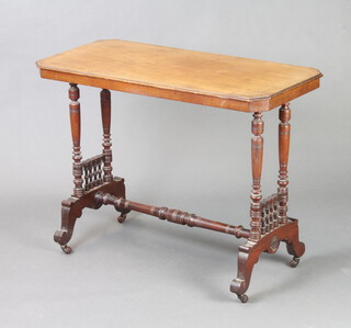 An Edwardian rectangular mahogany stretcher table with bobbin turned decoration, raised on turned supports 65cm h x 89cm l x 43cm w (marks to top and roundel to end missing) 