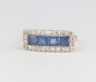 An Edwardian 18ct yellow gold sapphire and diamond cocktail ring with 4 princess cut sapphires surrounded by brilliant cut diamonds size M 1/2