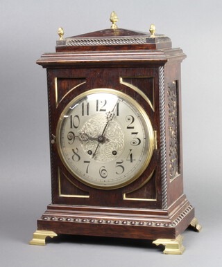 A Victorian Continental striking bracket clock with silvered dial, Arabic numerals contained in a rosewood case with fretted panels to the sides, complete with pendulum but no key 