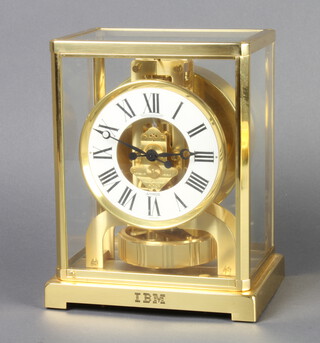 Jaeger LeCoultre, an Atmos clock with white dial and Roman numerals contained in a gilt metal case, the base engraved IBM, base marked Metal Caliber 528-8 22.5cm by 16.5cm by 12cm