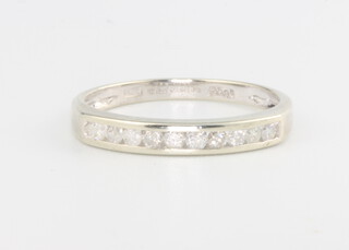 A 9ct white gold diamond half eternity ring, size M, 1.6 grams