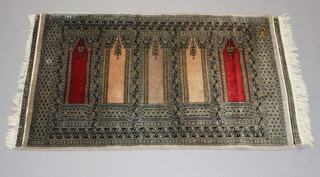 A Bokhara rug with 5 panels decorated mosque lamp and signed 164cm x 100cm 