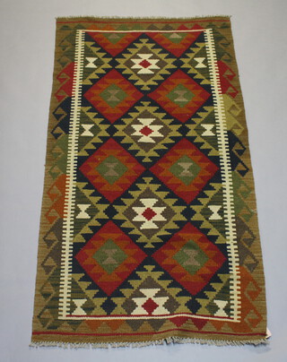 A brown and tan ground Kilim rug with all over diamond design 197cm x 102cm 