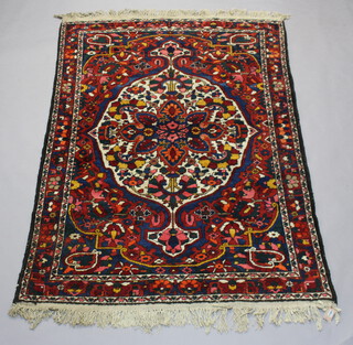 A blue and red ground Persian Bakhtiari rug with central medallion 220cm x 155cm 