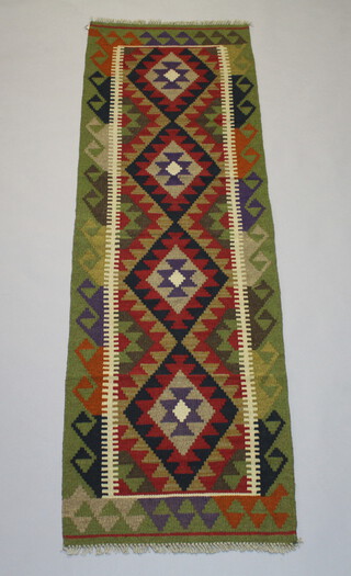 A black, tan and red ground Maimana Kilim runner with 4 stylised diamonds to the centre centre 207cm x 61cm 
