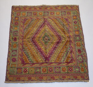 A brown and plum ground Gazak rug 127cm x 110cm 
