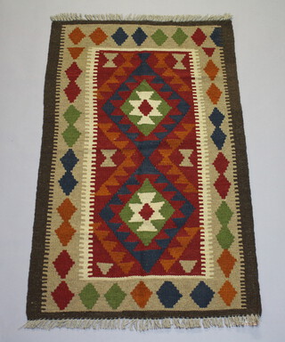 A brown, black and red ground Maimana Kilim with stylised diamonds to the centre within multi row border 130cm x 78cm 