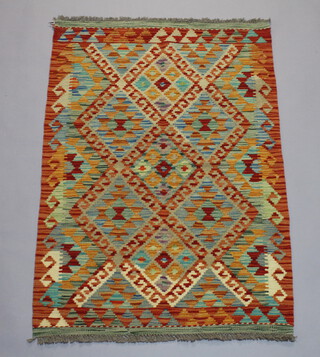 A yellow and turquoise ground Chobi Kilim with all over geometric design 120cm x 81cm 