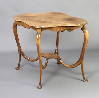 An Edwardian shaped bleached mahogany 2 tier occasional table raised on cabriole supports 71cm h x 94cm w x 68cm d 