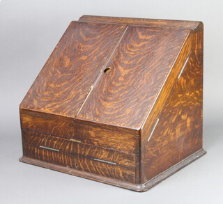 A Victorian wedge shaped oak stationery box with stepped fitted interior complete with cardboard date, month and day cars (complete) the base fitted a sliding drawer 34cm h x 38cm w x 33cm d  
