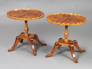 A pair of Georgian style oval figured walnut, quarter veneered and crossbanded wine tables raised on a turned column, platform base and splayed feet 45cm h x 44cm w x 36cm d 
