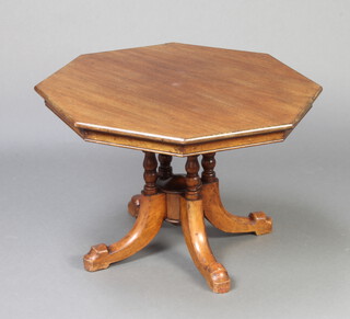 A Victorian octagonal walnut snap top occasional table raised on 4 turned columns and outswept supports 47cm h x 70cm w x 70cm d 