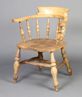 A 19th Century light elm bow chair with solid elm seat and double H framed stretcher