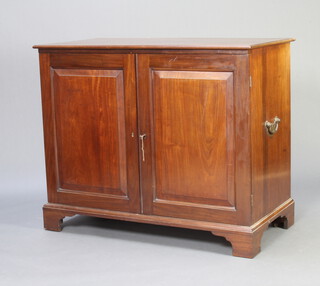 A 19th Century mahogany press cabinet, interior fitted 3 trays enclosed by panelled doors, brass carrying handles to the sides, raised on bracket feet 99cm h x 121cm w x 61cm d 