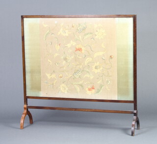An Edwardian rectangular mahogany fire screen with floral stitch work panel 91cm h x 95cm w x 22cm d 