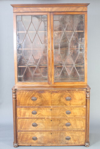A Georgian mahogany secretaire bookcase, the upper section with moulded cornice, interior fitted adjustable shelves enclosed by astragal glazed panelled doors, the secretaire drawer with fall front revealing a well fitted interior above 3 drawers with brass oval plate drop handles and turned columns to the sides 217cm h x 120cm w x 57cm d 