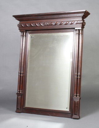 A 19th Century French rectangular bevelled plate over mantel mirror contained in a carved walnut frame with turned and fluted columns to the sides 119cm h x 95cm w x 15cm d 