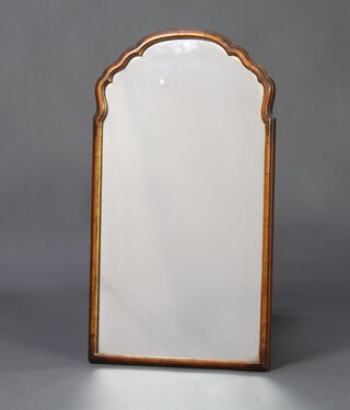 A 1930's Queen Anne style arched plate mirror contained in a walnut frame 68cm x 38cm