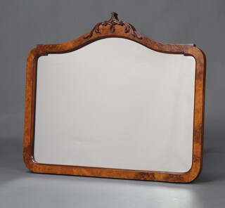 A 1930's Queen Anne style arched plate mirror contained in a walnut frame 56cm x 66cm 