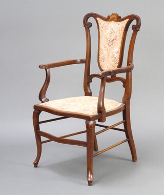An Edwardian inlaid bleached  mahogany open armchair with upholstered seat and back