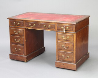 A Victorian walnut kneehole desk with red leather inset writing surface above 1 long and 8 short drawers 72cm h x 123cm w x 64cm d 