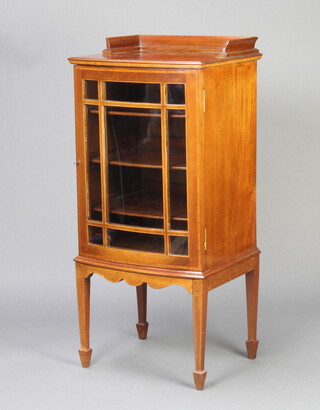 An Edwardian inlaid mahogany bow front display cabinet with 3/4 gallery, fitted shelves enclosed by astragal glazed panelled doors, raised on square tapered supports, spade feet 105cm h x 48cm w x 43cm d 