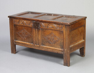 A 17th/18th Century carved oak coffer of panelled construction with original hinges 57cm h x 105cm w x 47cm d 