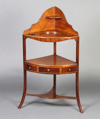 A Georgian mahogany corner wash stand with raised back fitted 2 bowl recepticals, the undertier fitted 1 long drawer flanked by 2 dummy drawers 104cm h x 58cm w x 41cm d 